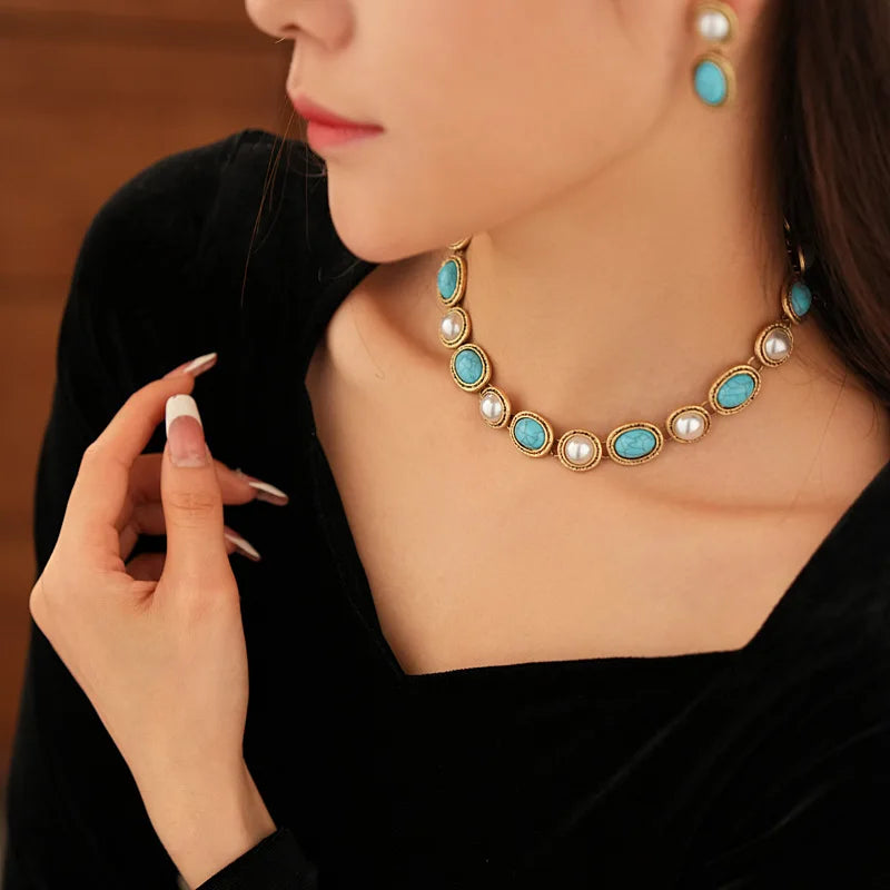 Close-up of turquoise beads paired with pearls on the necklace strand