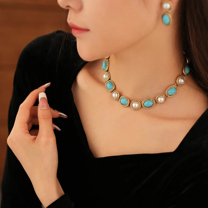Close-up of turquoise beads paired with pearls on the necklace strand
