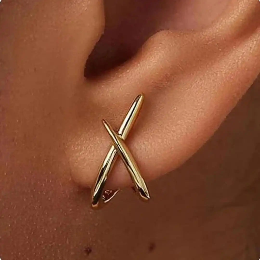 Main shot of the minimalist gold cross earrings