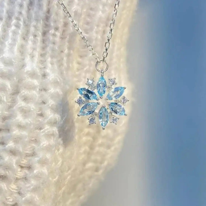 Main shot of the blue snowflake pendant necklace