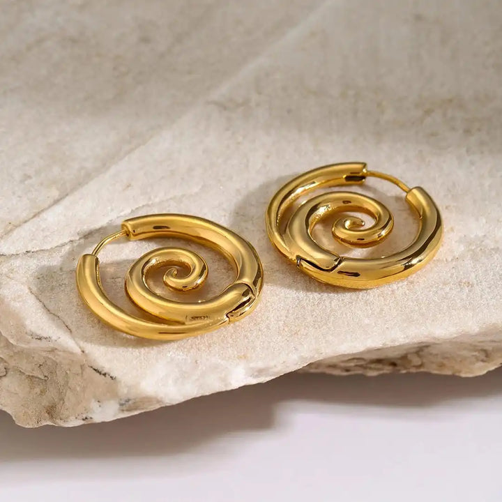 Earrings worn on a model's ear