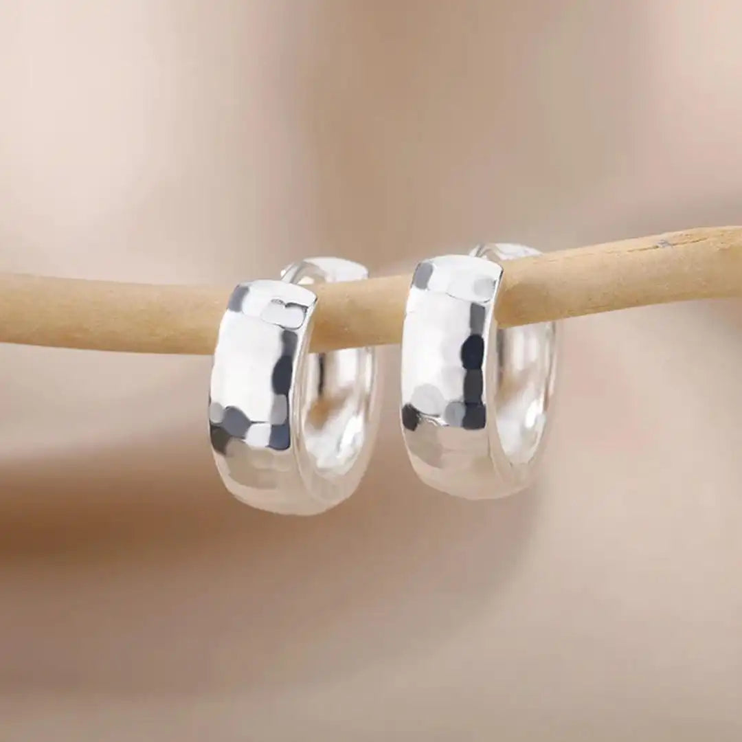 Earrings worn on a model's ear