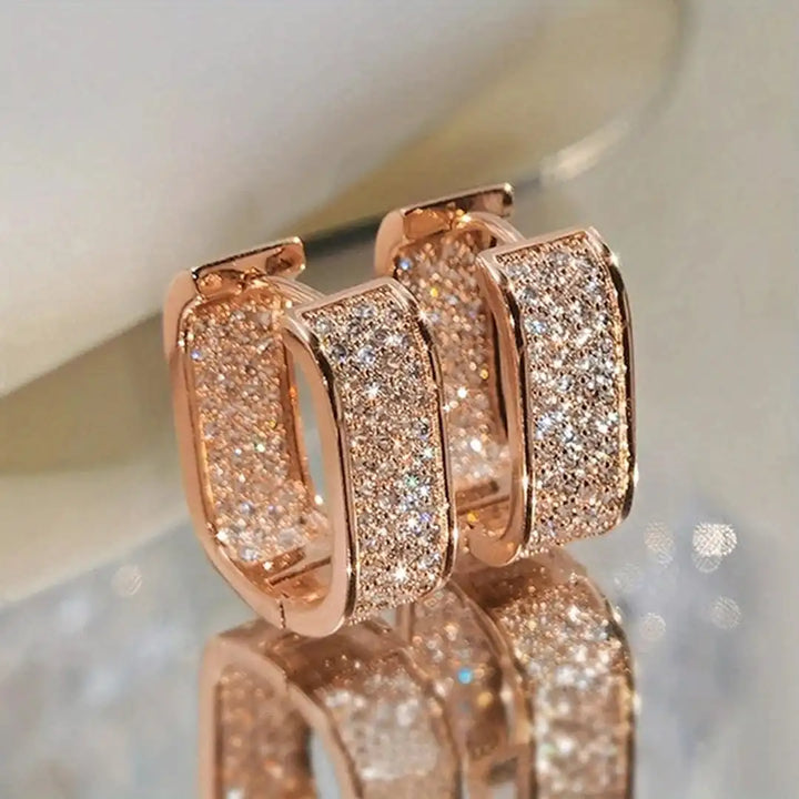 Earrings worn on a model's ear