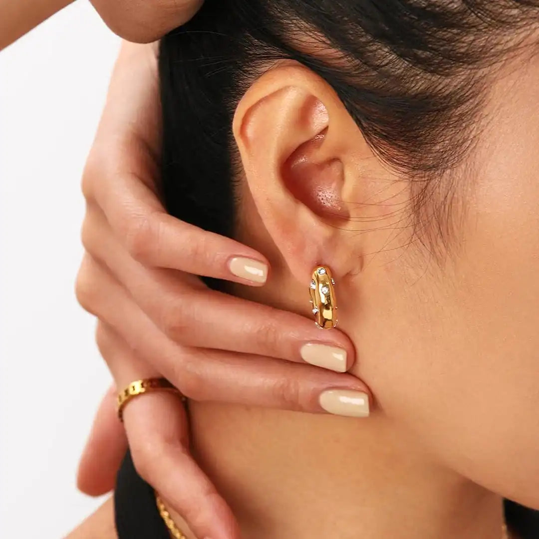 Earrings worn on a model's ear