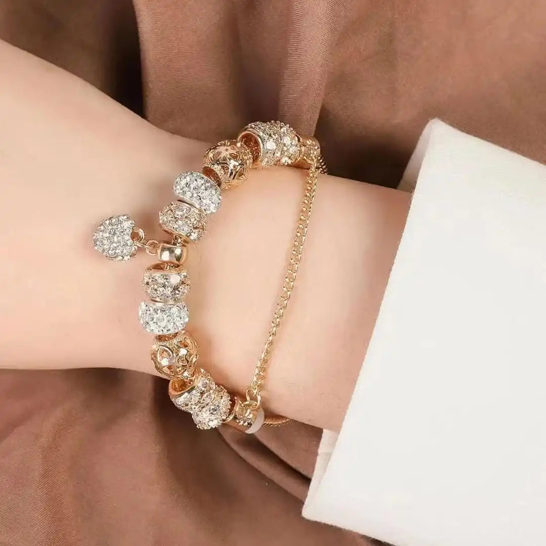 Main shot of the gold heart charm bracelet