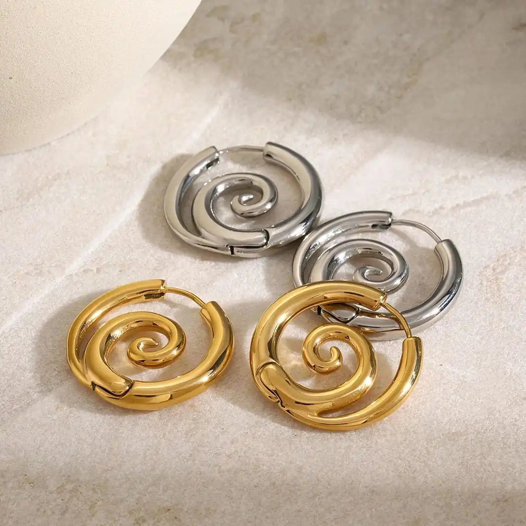 Main shot of the timeless gold spiral earrings