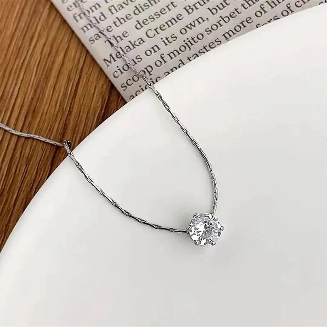 Main shot of the dainty gold solitaire necklace