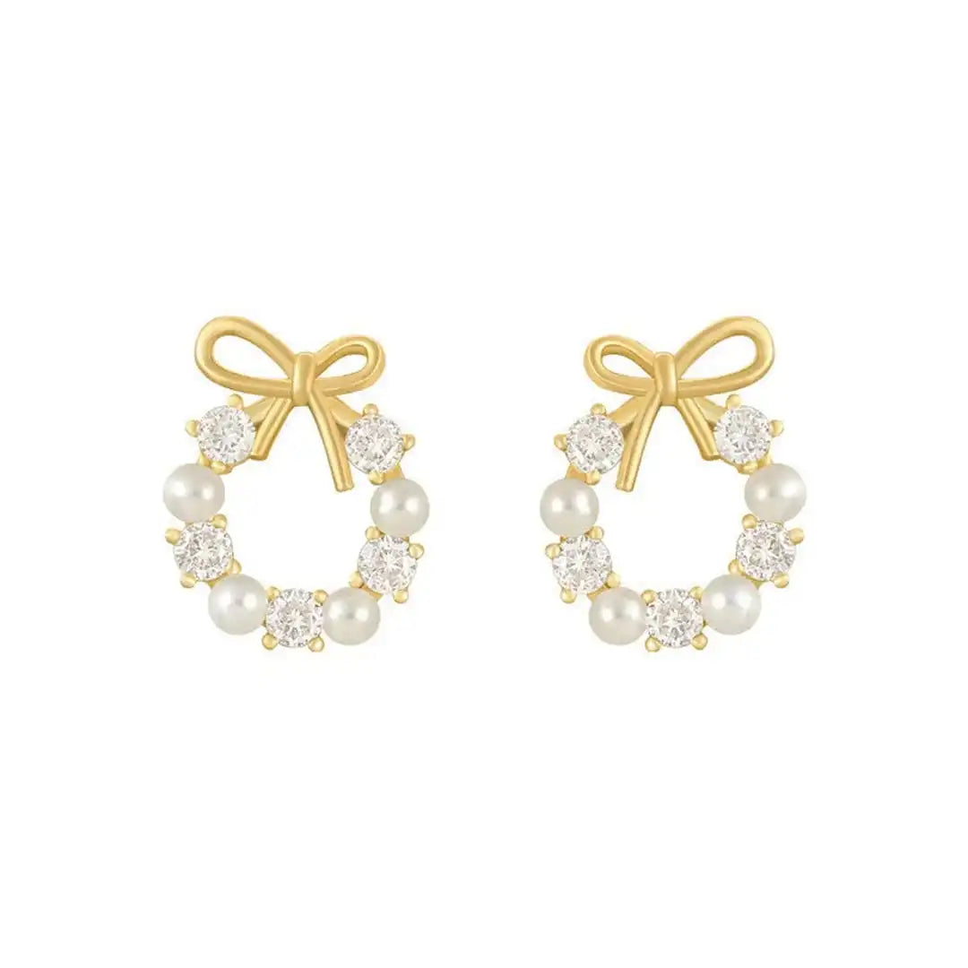 Earrings laid flat on a neutral background