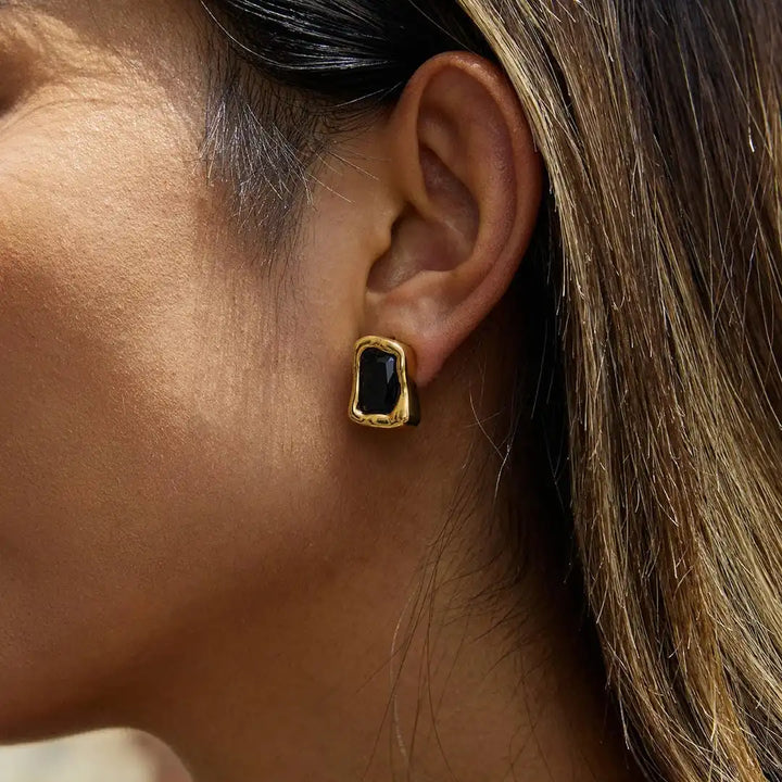 Earrings worn on a model's ear