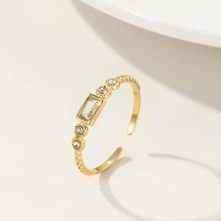 Main shot of the simple gold zircon open ring