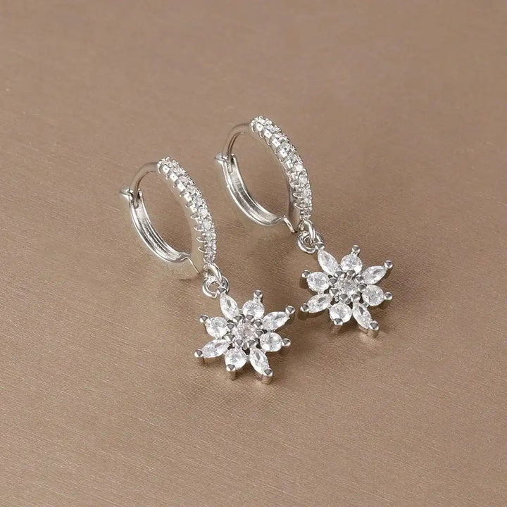 Earrings worn on a model's ear