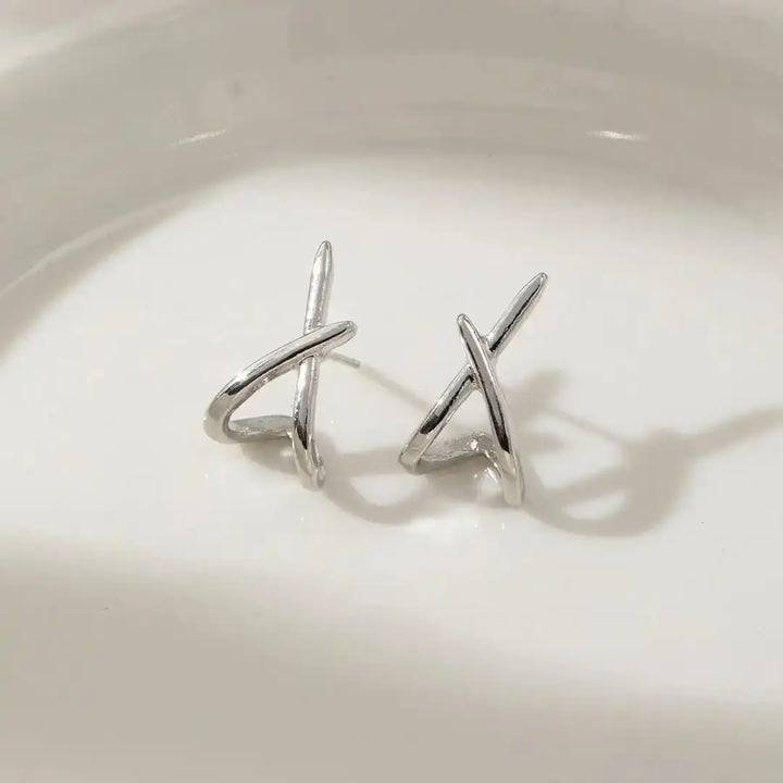Both earrings displayed together on a jewellery tray