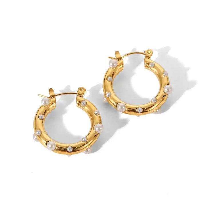 Earrings displayed on a jewellery stand