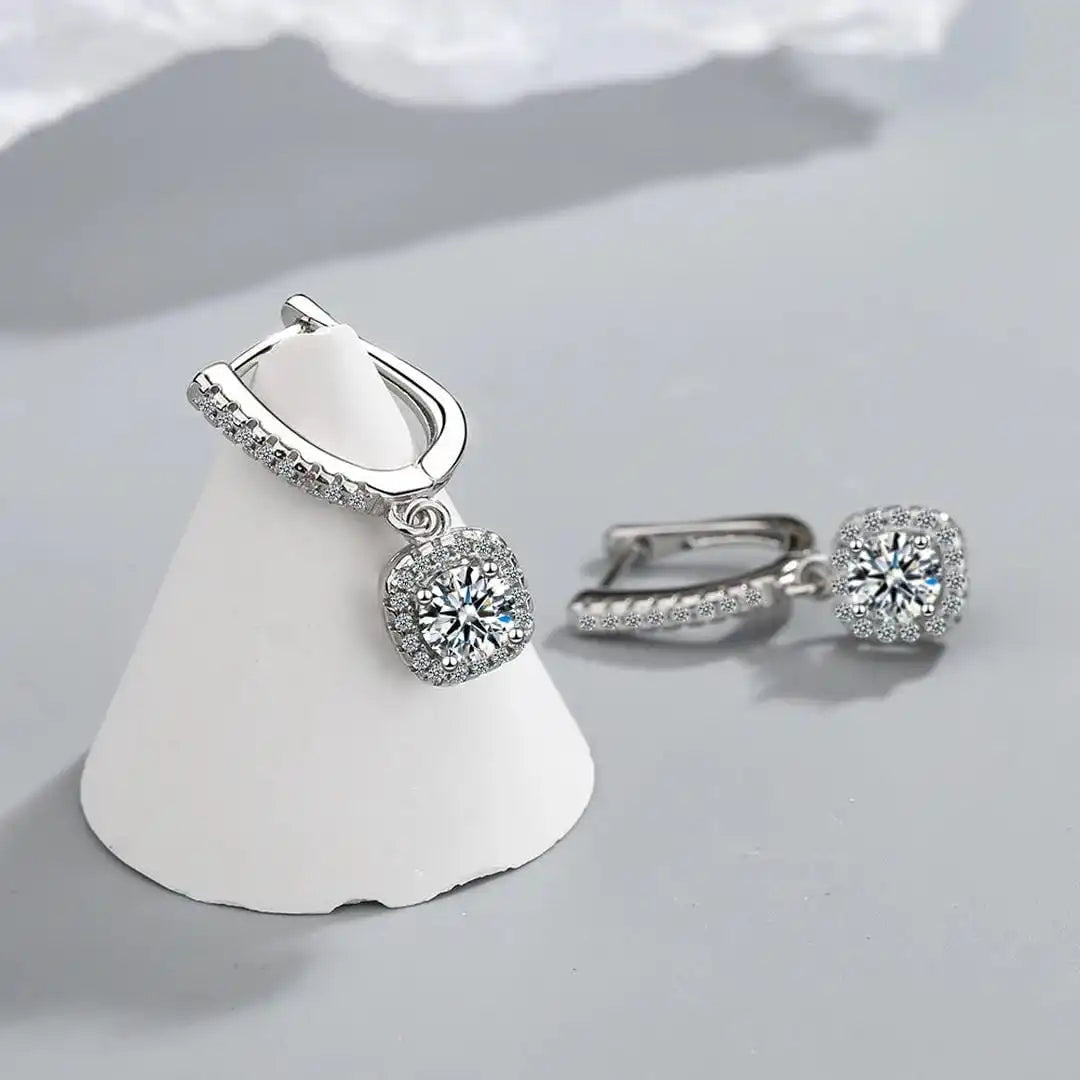 Earrings worn on a model's ear