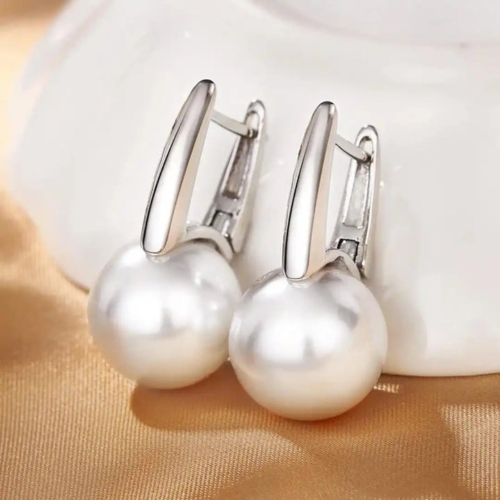 Earrings worn on a model's ear