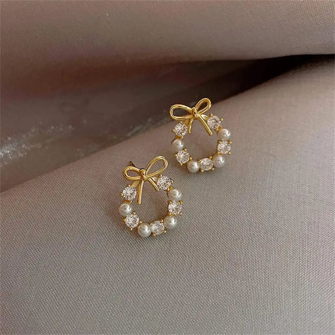 Earrings worn on a model's ear