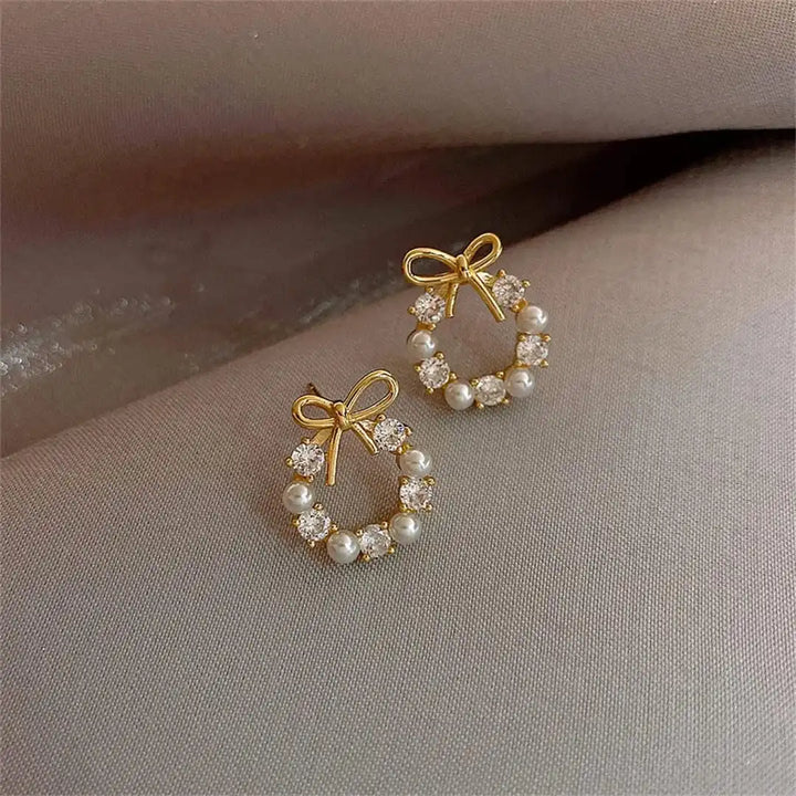 Earrings worn on a model's ear