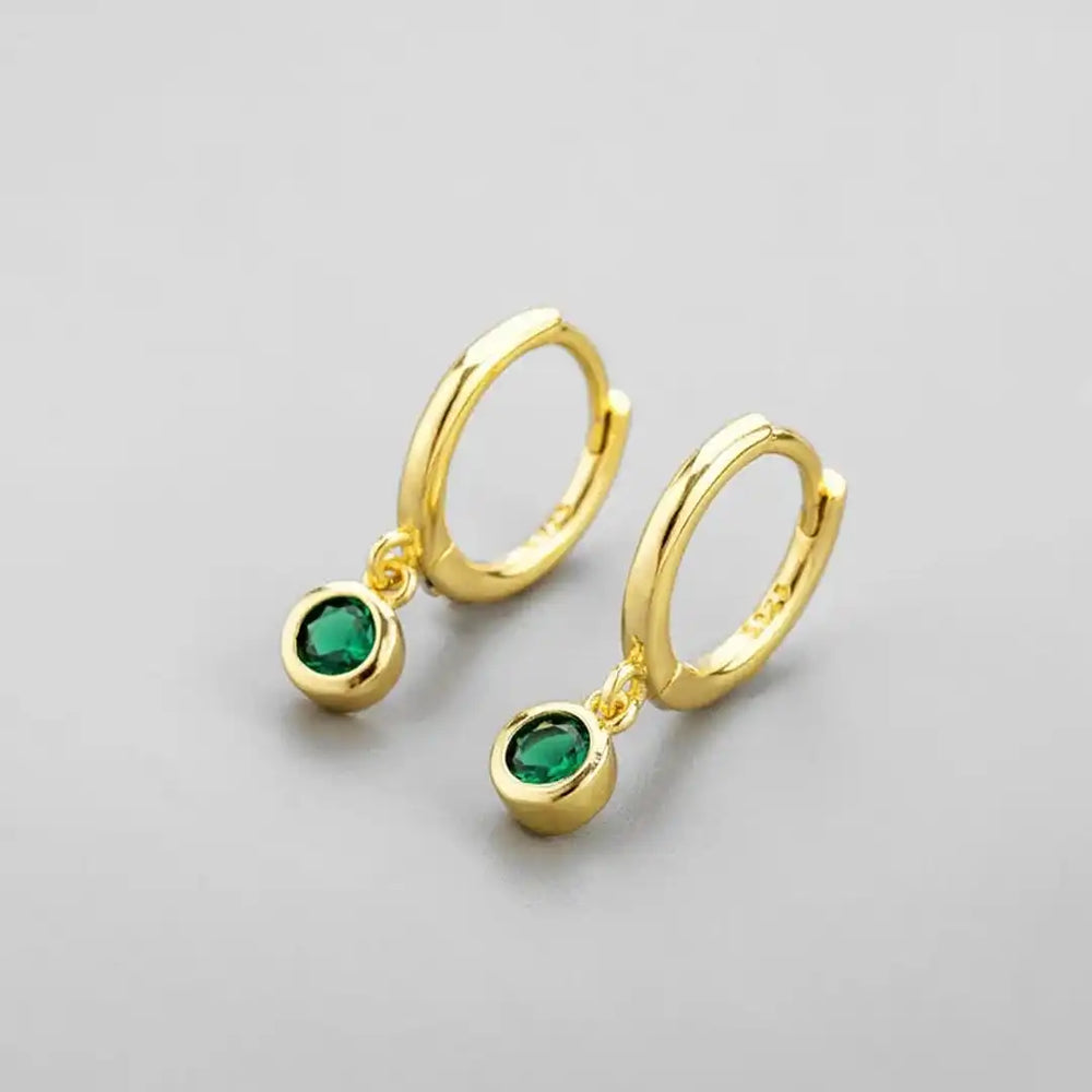 Earrings worn on a model's ear