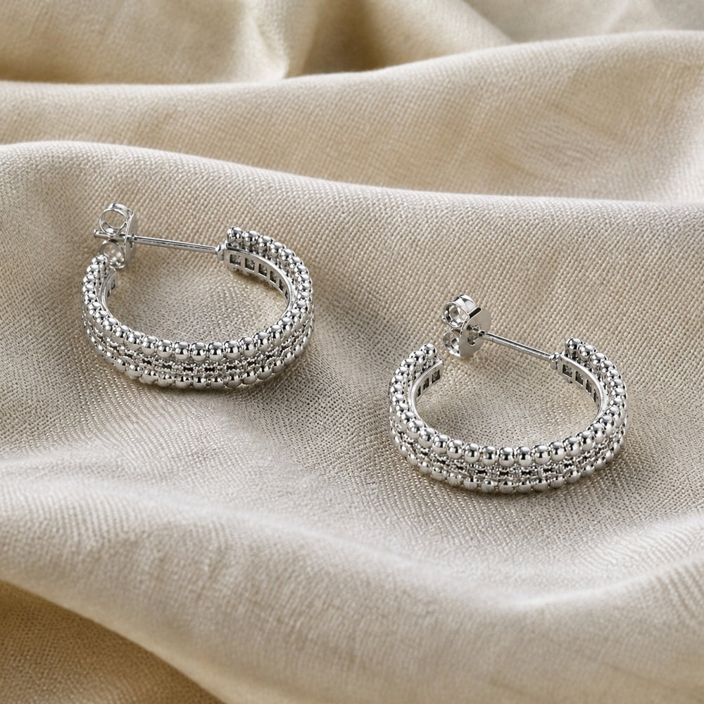 Earrings worn on a model's ear