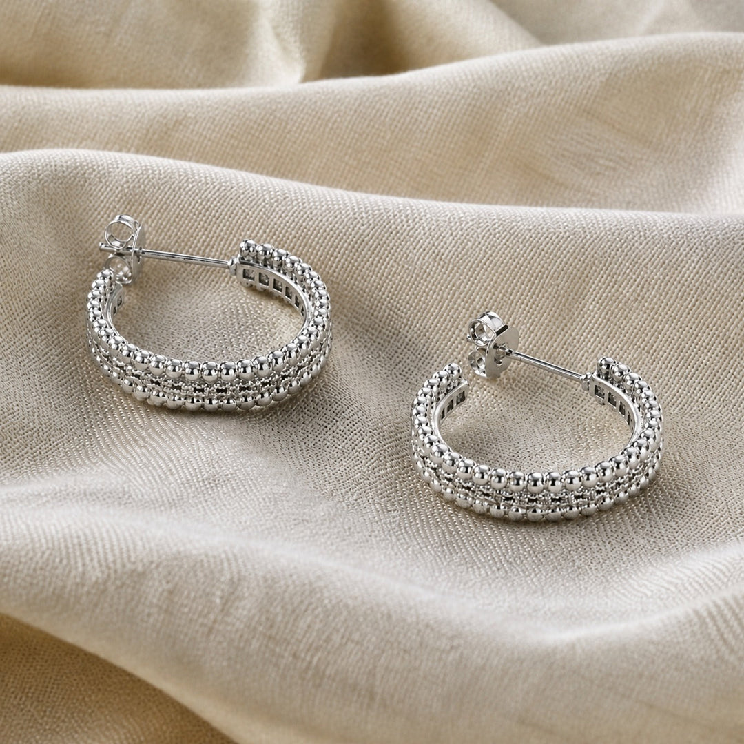 Earrings worn on a model's ear