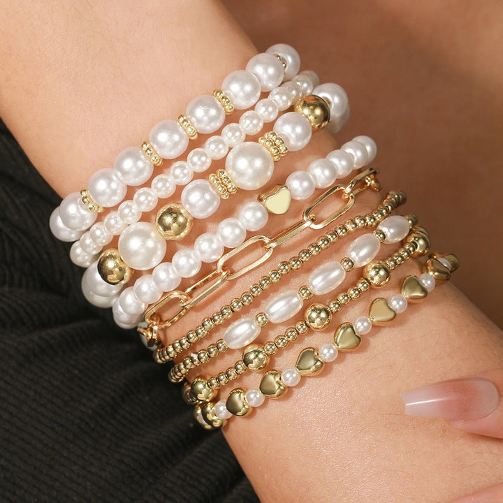 Premium pearl stacking bracelet set of nine strands laid flat