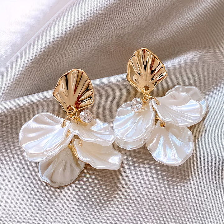 Frosted petal pearl earrings shown on a white background