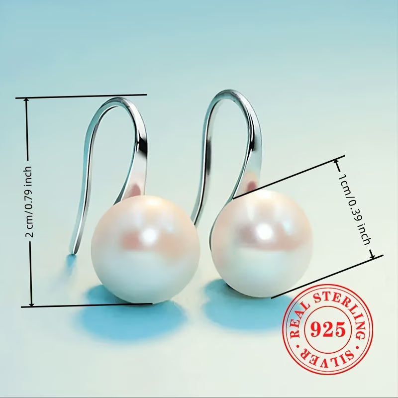 Model wearing the essential pearl stud earrings