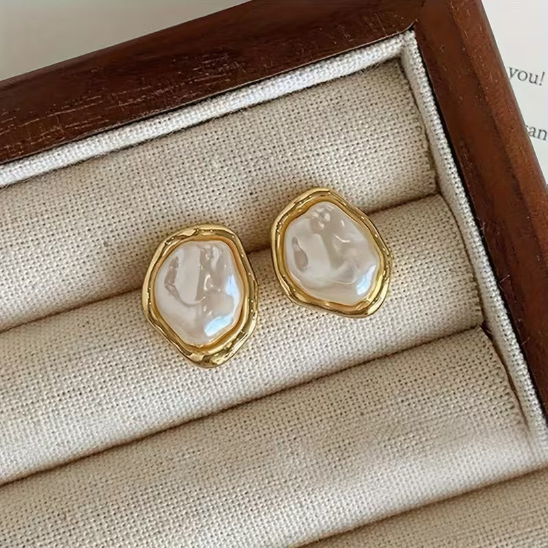 Exquisite pearl drop earrings shown together on a white background