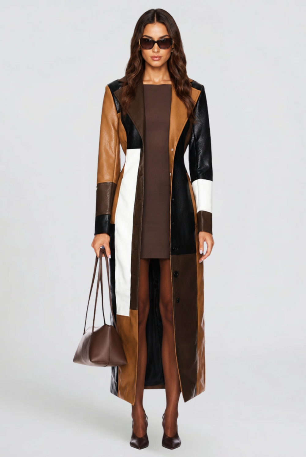 Colour block faux leather longline coat worn open over brown mini dress, front view
