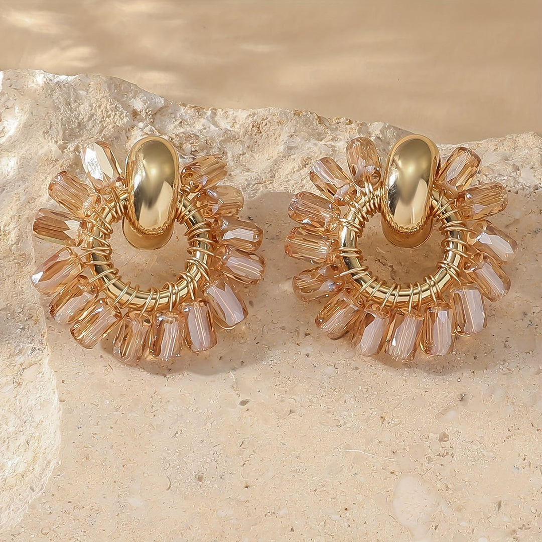 Pair of fan earrings displayed on a jewellery pad
