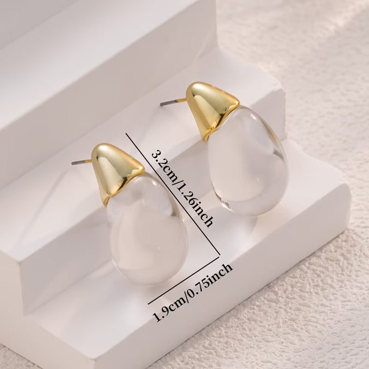 Model wearing the acrylic teardrop earrings in natural light