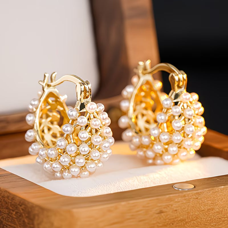 Chunky pearl hoop earrings laid flat showing the bold hoop shape
