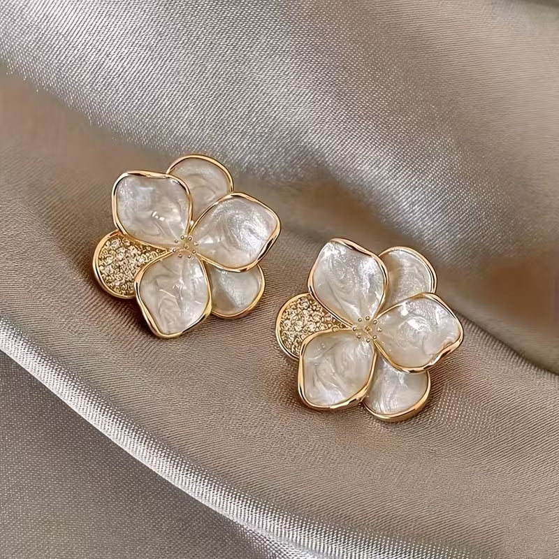 Elegant pearl flower earrings shown on a white background