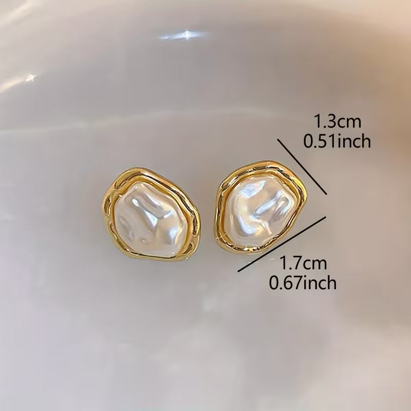 Side view of the earring hook and pearl drop detail