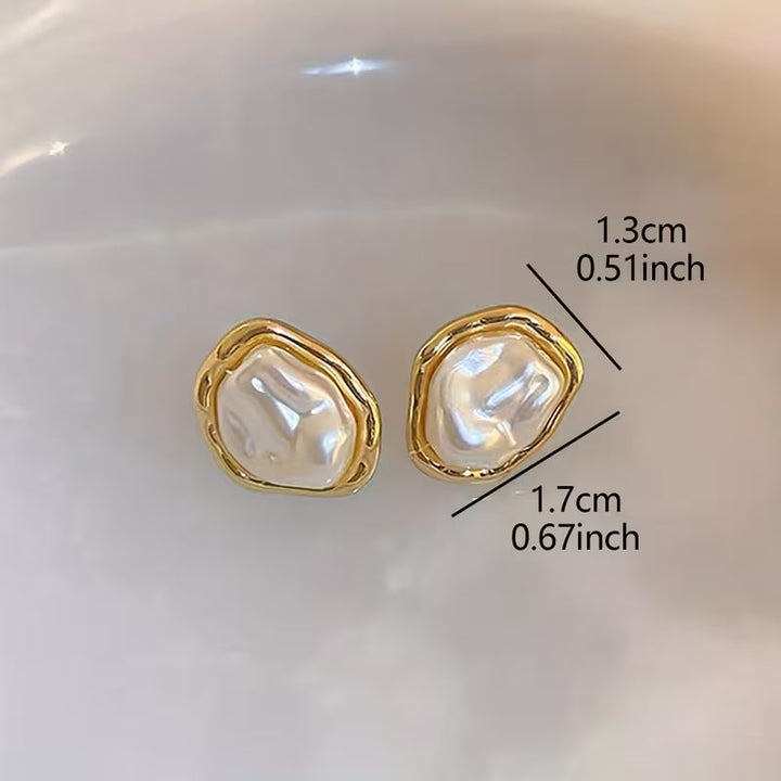 Side view of the earring hook and pearl drop detail