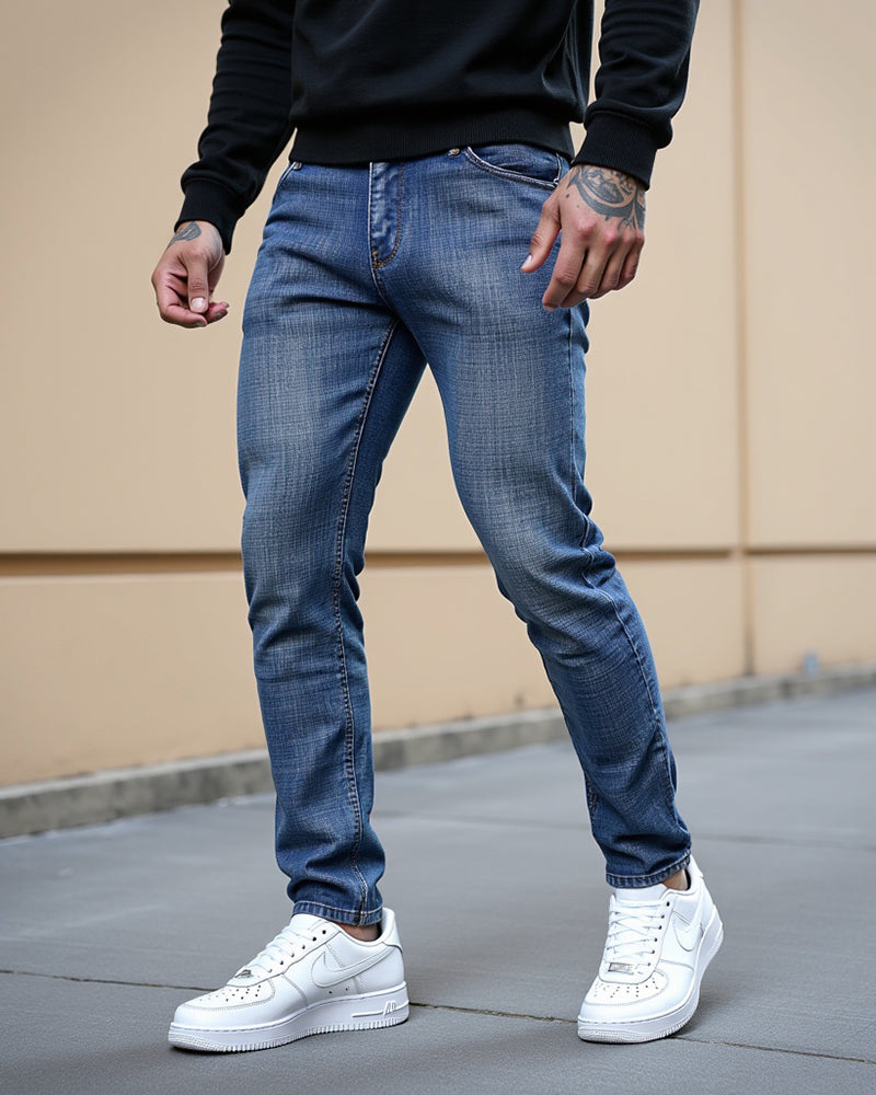 Avenue slim fit jeans in blue wash, styled outdoors