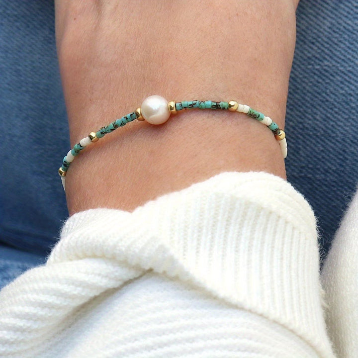 Detail shot of the bracelet's elastic stretch band and bead spacing