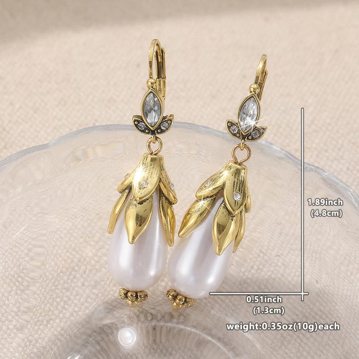 Model wearing the vintage-style pearl earrings