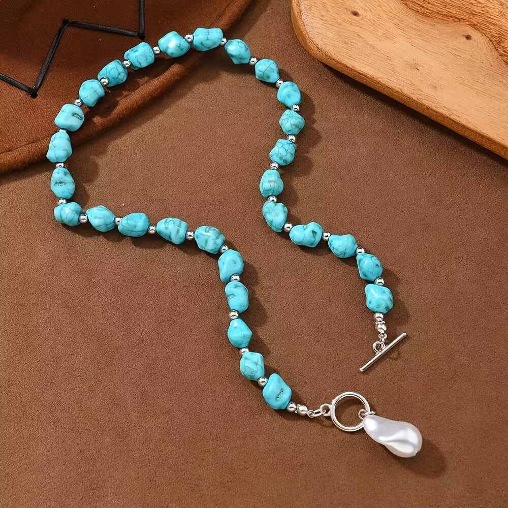 Side view showing the necklace's silver-tone chain and clasp