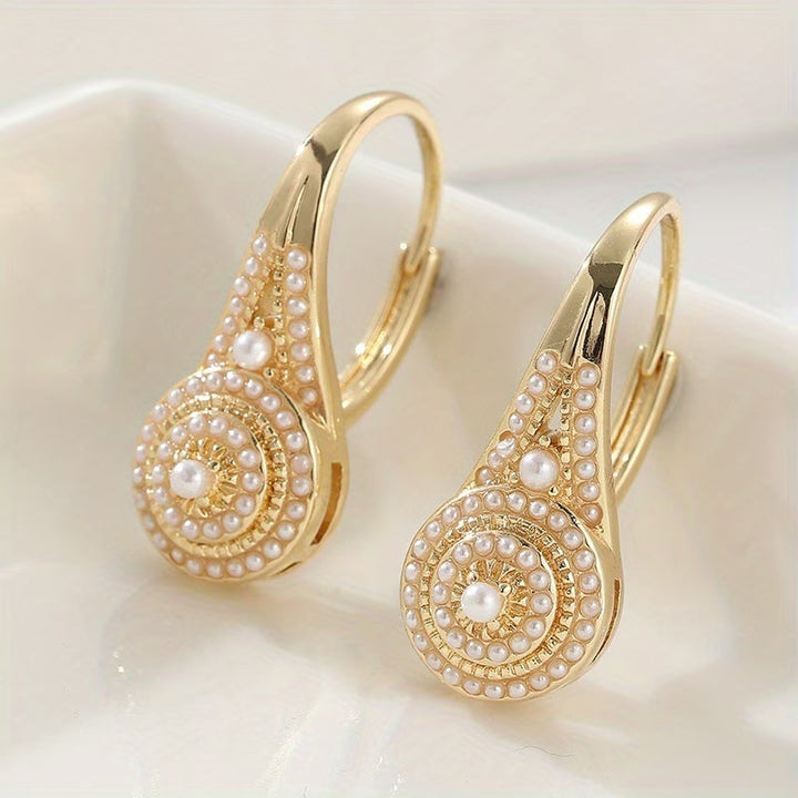 Pearl bloom stud earrings shown on a white background