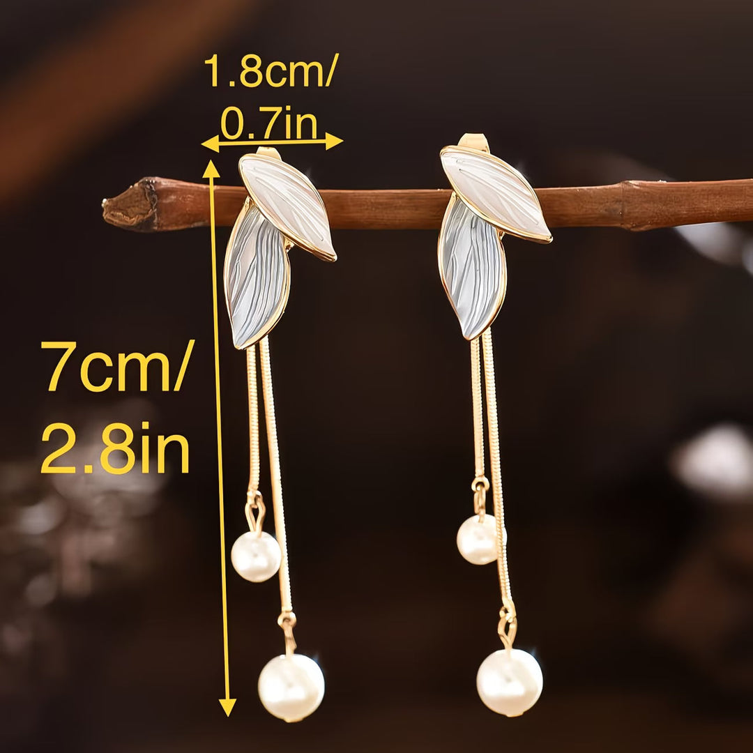 Pair of earrings shown side by side to compare symmetry