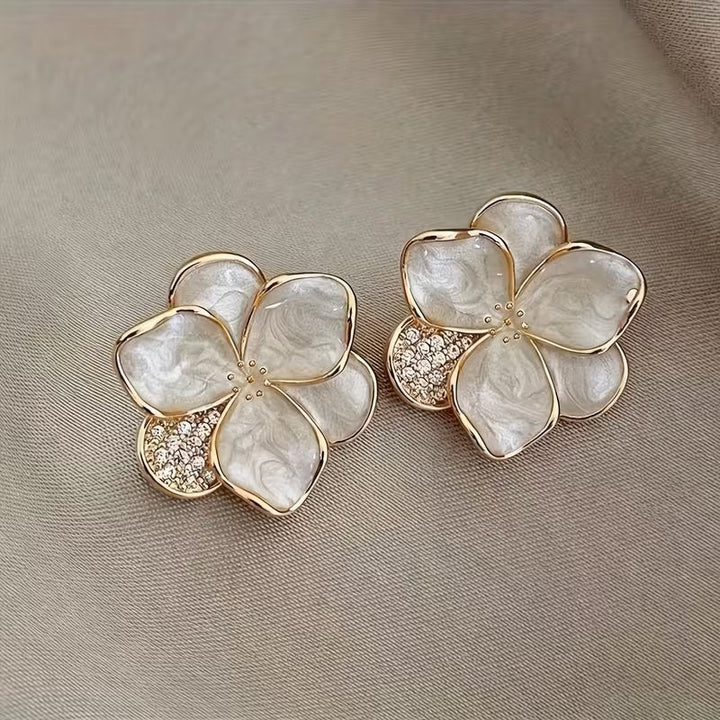 Elegant pearl flower earrings photographed from a side angle
