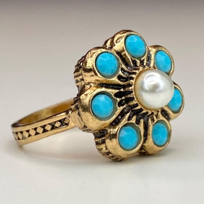 Top-down view of the pearl and turquoise setting