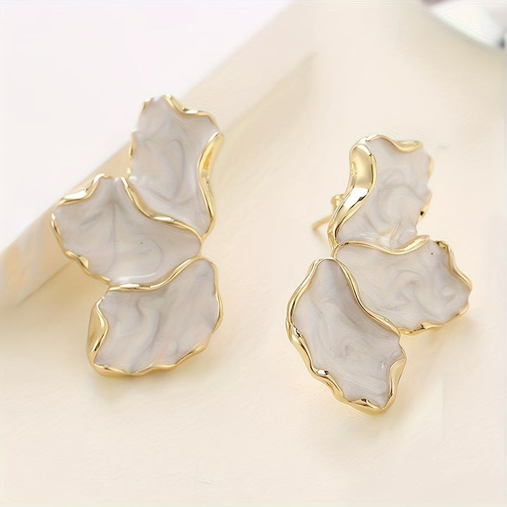 Pearl flower petal earrings shown from a side angle
