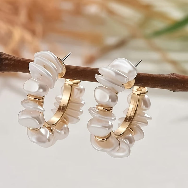 Model wearing the chunky pearl drop earrings