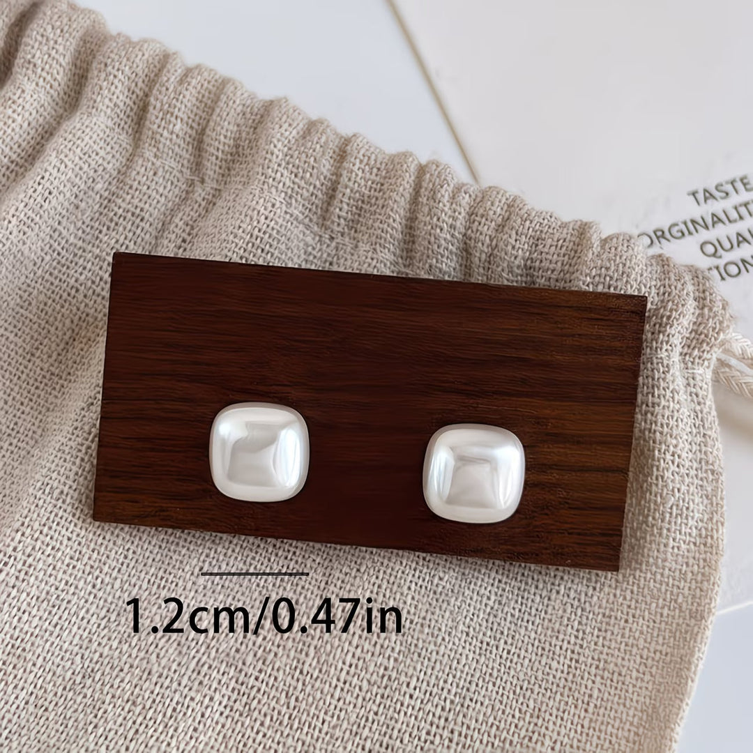 Side angle showing the earring's geometric silhouette