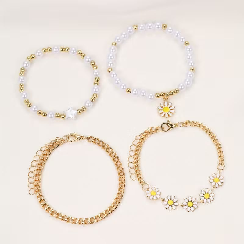 Model wearing the full daisy stacking bracelet set