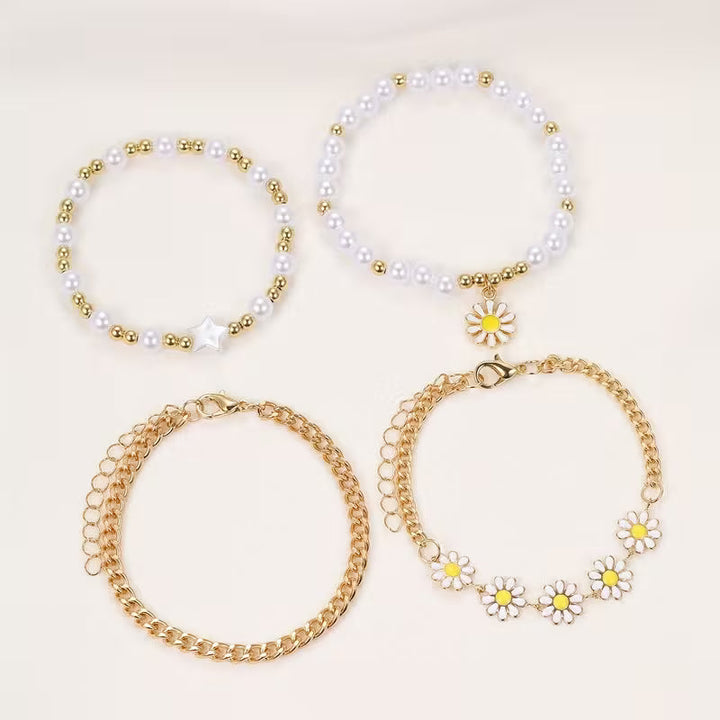 Model wearing the full daisy stacking bracelet set