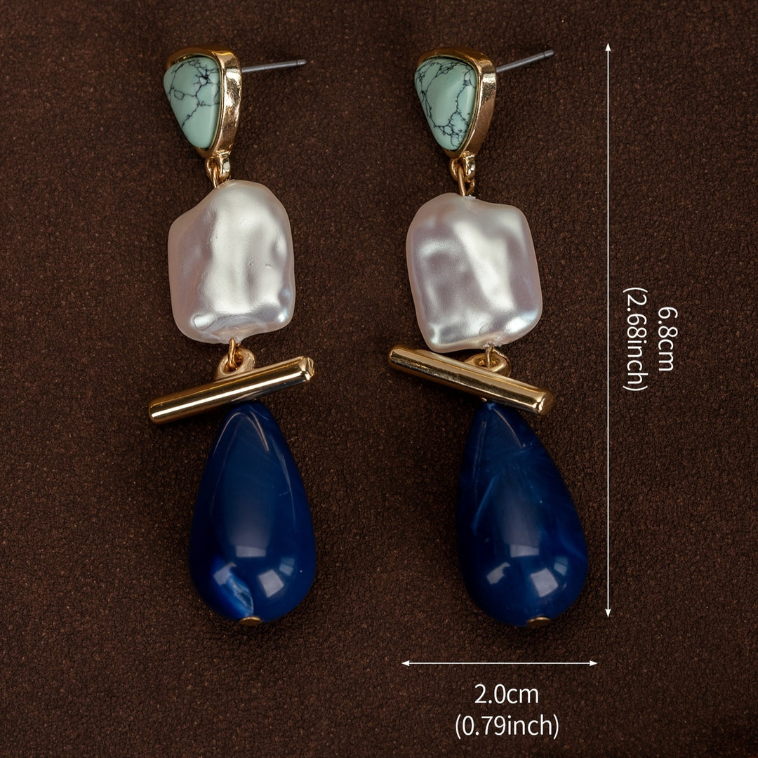 Earrings styled on a jewellery tray with soft lighting