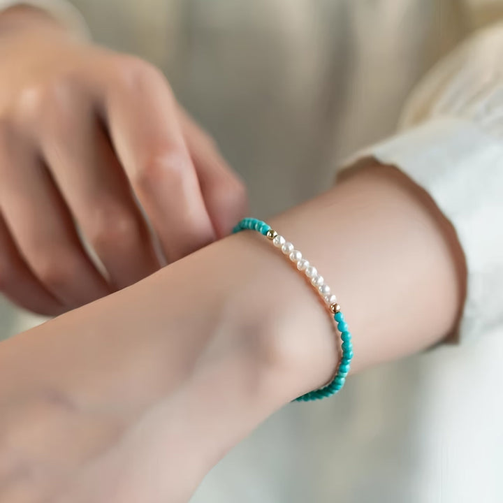 Close-up of the pearl and turquoise bead mix